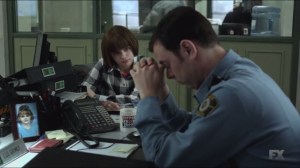 A Muddy Road- Gus and Greta Grimly look through mugshots