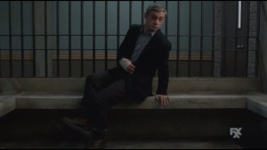 Eating the Blame- Lester alone in jail cell