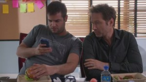 Julia- Hugh takes a picture with his burger