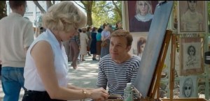 Big Eyes- Margaret meets Walter Keane, played by Christoph Waltz, at art gathering