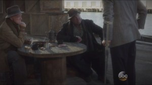 The Blitzkrieg Button- Sousa speaks with two men at the docks