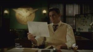 The Iron Ceiling- Sousa looks at the club photo with Peggy in it