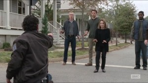 Try- Rick points his gun at Deanna and folks