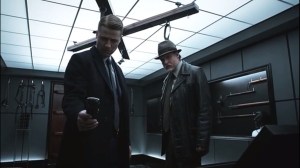 The Anvil or the Hammer- Gordon and Bullock investigate James' apartment and find his play room, phone rings