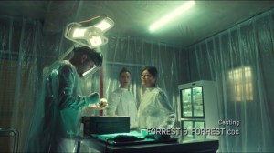 Scarred by Many Past Frustrations- Miller, Dr. Coady, and Dr. Silva look at the body of the baby in the coffin