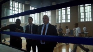 Strike Force- Gus Freeman, played by Danny Johnson, shows Barnes and Gordon around the gym