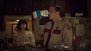 Waiting for Dutch- Lou drinks milk right from the carton while Betsy, played by Cristin Milioti, watches