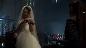 Tonight's the Night- Barbara in a wedding dress and holding a shotgun