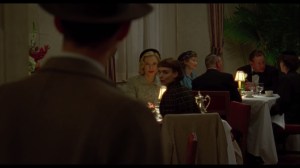 Carol- Jack Taft, played by Trent Rowland, finds Therese Belivet, played by Rooney Mara, having dinner with Carol Aird, played by Cate Blanchett