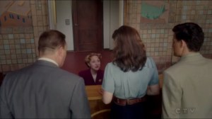 The Lady in the Lake- The Isodyne receptionist, played by Angela Cristantello, tells the agents about Isodyne Energy