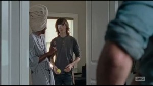 The Next World- Michonne in a robe, Carl with an eyepatch