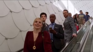 Above Board Metrics- Group on escalator as Jeannie spots the twins