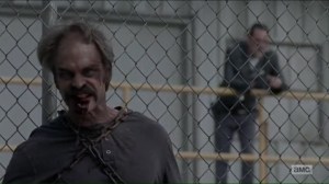 Worth- Simon on the fence as a walker- AMC, The Walking Dead