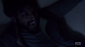 A New Beginning- Siddiq grabbed by walker with spiders coming out of it- The Walking Dead