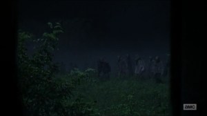 Evolution- Walkers approach the shed- The Walking Dead, AMC