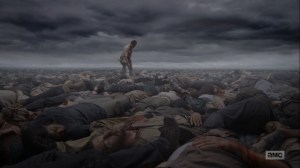 What Comes After- Rick walks atop a pile of dead bodies- The Walking Dead, AMC