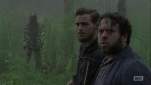 Adaptation- Alden and Luke surrounded by Whisperers- AMC, The Walking Dead