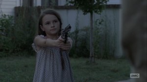 Adaptation- Judith points a gun at Negan- AMC, The Walking Dead