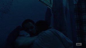 Omega- Walker bites one of the survivors in Lydia's camp- AMC, The Walking Dead