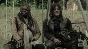 Scars- Michonne and Daryl rest on a swing set- AMC, The Walking Dead