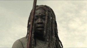 Scars- Michonne looks at her bloody sword- AMC, The Walking Dead