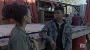 The Calm Before- Kelly signs to Connie about her concern- AMC, The Walking Dead