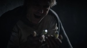 A God Walks Into a Bar- Adrian finds a horseshoe in the cake- HBO, Watchmen