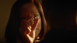 A God Walks Into a Bar- Angela holds the Tachyon device- HBO, Watchmen