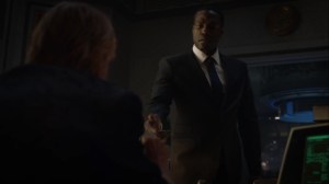 A God Walks Into a Bar- Jon about to accept the device from Adrian- HBO, Watchmen