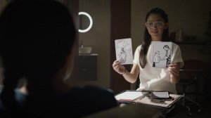 An Almost Religious Awe- Bian shows Angela two images- HBO, Watchmen