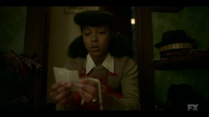 The Pretend War- Ethelrida examines a bracelet and newspaper clippings- Fargo, FX