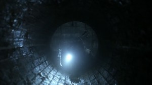 Acheron Part II- Daryl heads into a sewer pipe- AMC, The Walking Dead