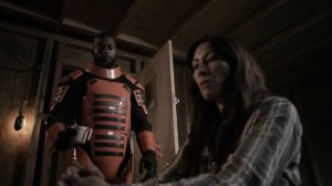 Acheron Part II- Guard brings a cup of coffee for Yumiko- AMC, The Walking Dead