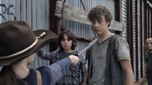Out of the Ashes- Judith puts her sword to some kid's neck- AMC, The Walking Dead