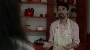 Out of the Ashes- Tomi drops his cake upon seeing Yumiko again- AMC, The Walking Dead