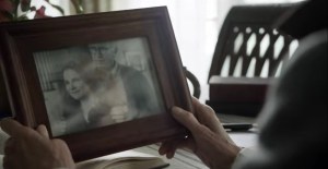 The Lucky Ones- Pamela looks at a photo of Deanna and Reg- AMC, The Walking Dead