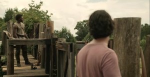 Warlords- Marco and Elijah shoot arrows at walkers- AMC, The Walking Dead