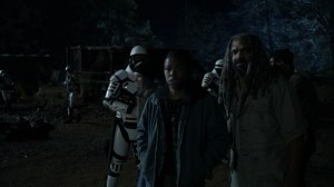 Outpost 22- Kelly and Ezekiel watch Commonwealth soldier gun down walkers- AMC, The Walking Dead