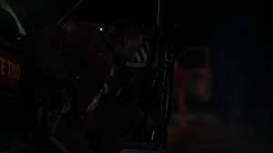 The Tragedy of the Commons- Deputy Witt Farr, played by Lamorne Marris, hides from gunfire- Fargo, FX